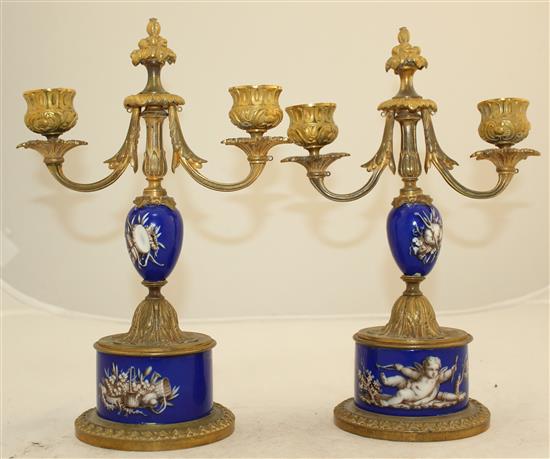 A pair of 19th century French ormolu mounted porcelain candelabra, 10in.